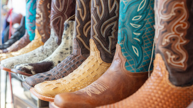 Mexico, Texas United State. Multicolor leather cowboy boots neatly displayed a store shelf.