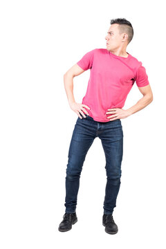 Full body of shocked male in casual clothes standing with hands on waist isolated