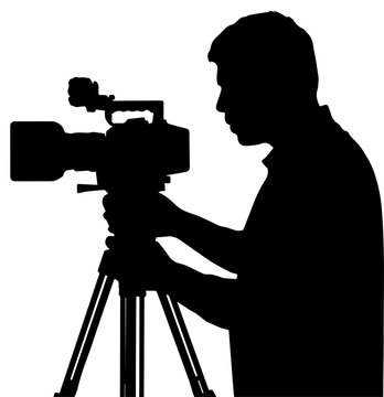Silhouette of a Professional Cameraman Operating a Video Camera on a Tripod for Filming and Videography