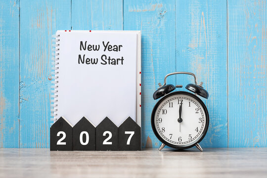 2027 Happy New Yea  New start, black retro alarm clock and wooden number.Resolution, Goals, Plan, Action and Mission Concept