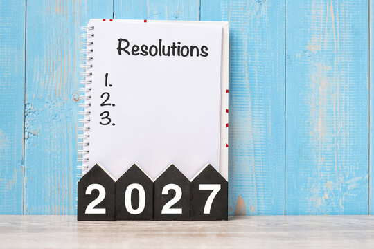 2027 Happy New Year with RESOLUTION word and wooden number. time for a New Start, goal, Plan, Action and Mission Concept