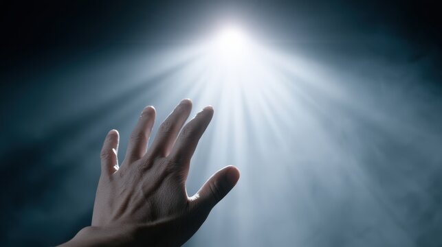 A hand reaches towards a bright, ethereal light source, evoking a sense of hope, spirituality, and aspiration. ..Created with Generative AI, not depicting real subjects.