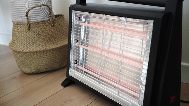 An electric heater is effectively warming up the room in a cozy home setting