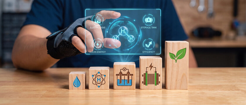 Modern technology specialist interacting with holographic hydrogen energy interface displaying electrolysis process icons above wooden blocks