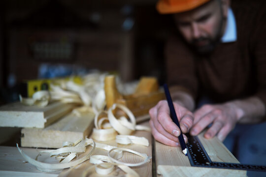 Plane jointer carpenter or joiner tool and wood shavings. Woodworking tools on wooden table. Carpentry workshop