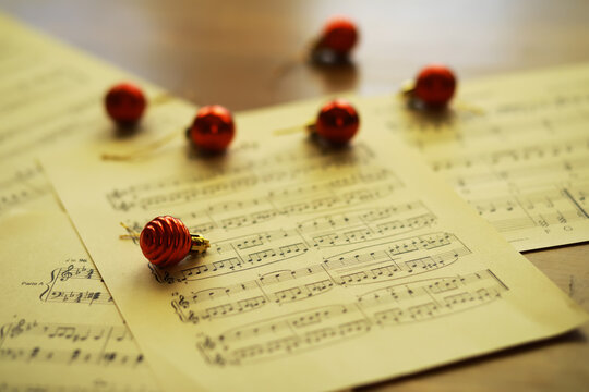 Christmas Sheet Music. Christmas decorations on music sheets, closeup