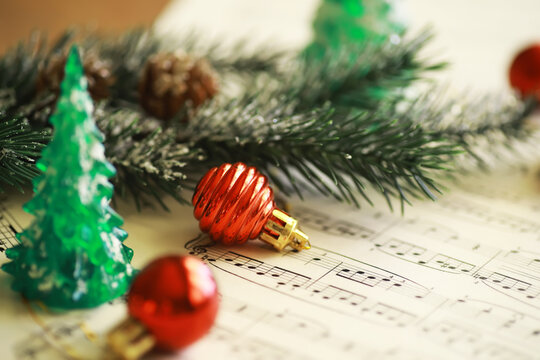 Christmas Sheet Music. Christmas decorations on music sheets, closeup