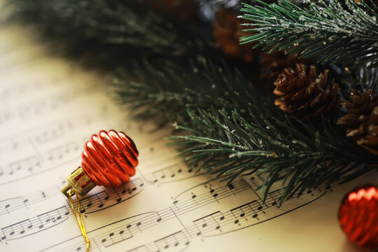 Christmas Sheet Music. Christmas decorations on music sheets, closeup