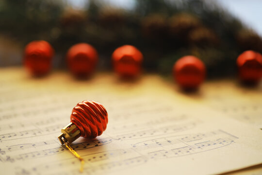 Christmas Sheet Music. Christmas decorations on music sheets, closeup