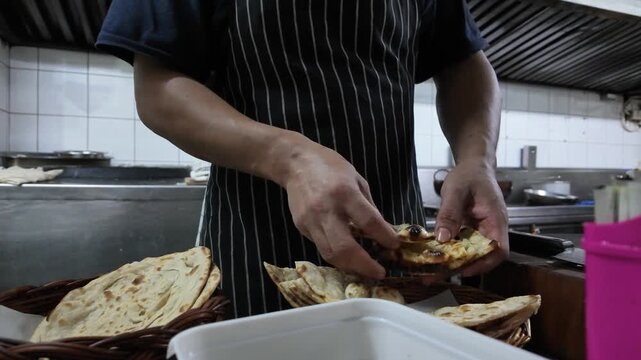 Chef Preparing Fresh Naan Bread in Restaurant Commercial Kitchen