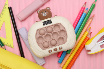 School stationery and accessories for elementary school on a pink background. Back to school concept. © splitov27