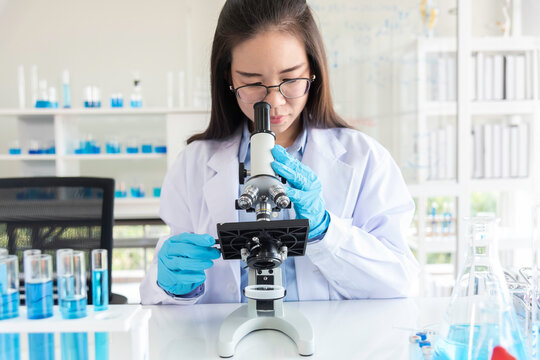 Scientist Professional researcher performs chemical analysis in bright, sterile environment
