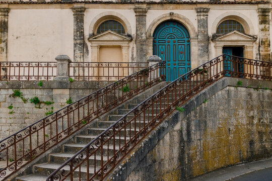 palace facade entrance background winding stairs and arch door with aged exterior space