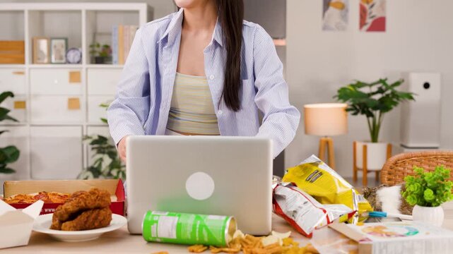 Woman Working on Laptop Leaves Junk Food Table to Eat Apple