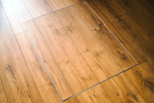 Wooden floor access door as abstract interior background
