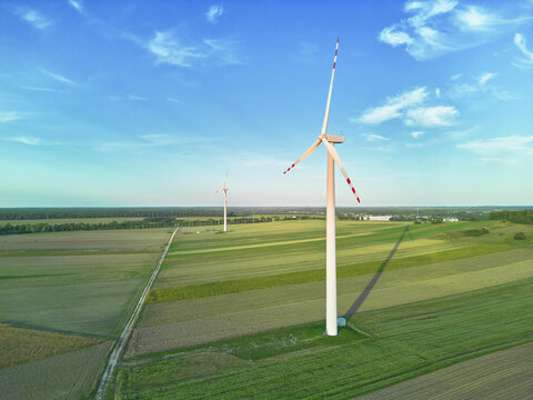Renewable energy wind turbine on sunny day