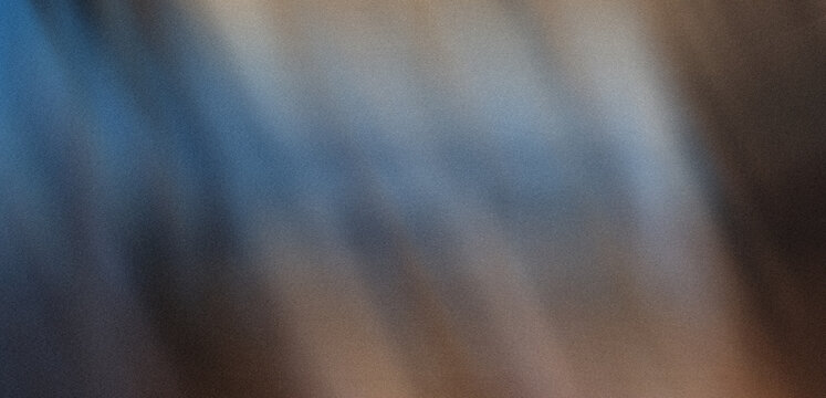 Abstract blurry gradient background featuring soft blue, warm brown, and dark tones with delicate grainy texture