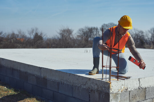 Construction worker working outdoors on a construction site.