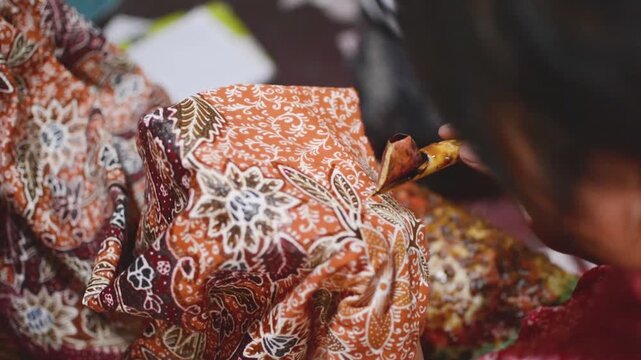 Batik Artisan Creating Intricate Patterns on Fabric