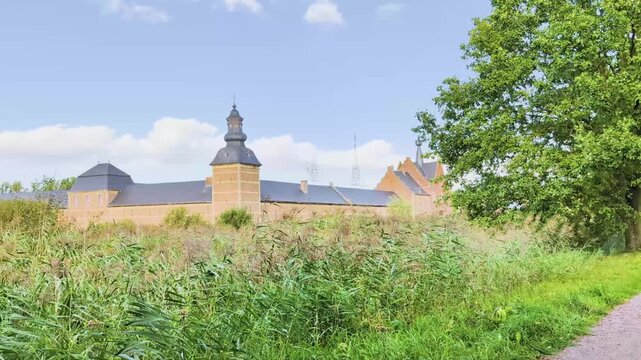 View of Herkenrode Abbey in Belgium from a distance with surrounding nature