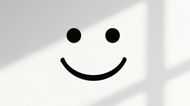 A minimalist representation of a smiley face against a white wall, showcasing playful emotions and simple design elements, enhanced by gentle shadow play.