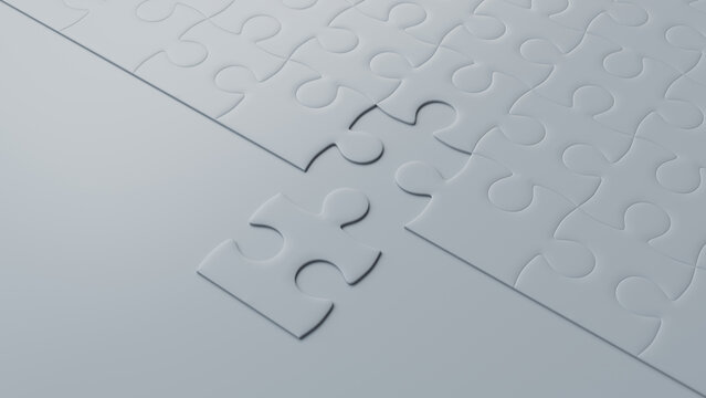 Close up of White Jigsaw Puzzle texture Background with final piece moving into place. Problem Solving Concept.