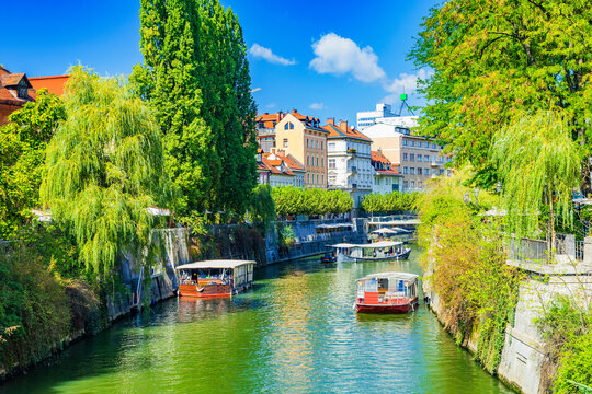 Romantic Ljubljana. River Ljubljanica and beautiful green waterfront in city of Ljubljana, capital of Slovenia, popular tourist sight 