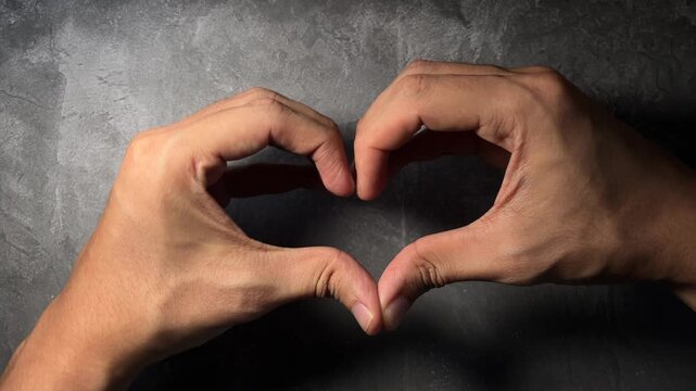two hands forming heart shape