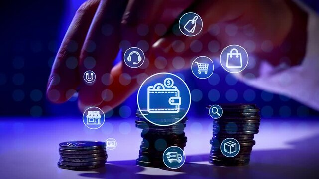 Stacks of coins are arranged on a table. A hand reaches toward an icon of a wallet. Other icons show shopping, audio, and transactions. The scene has a blue background.