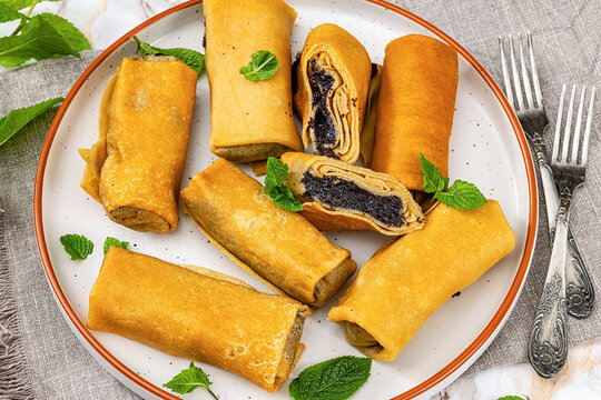 Nalysnyky thin crepes filled with poppy seed paste
