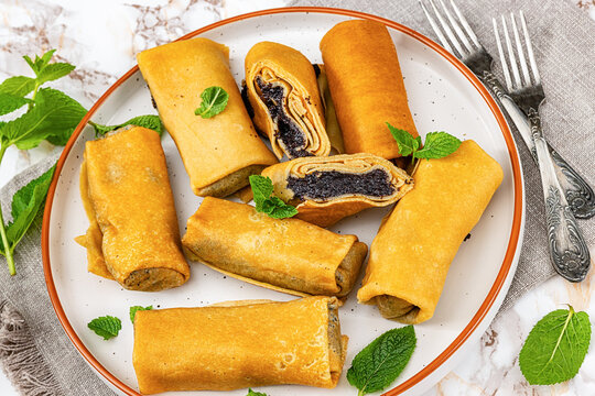 sweet thin rolled crepes with poppy seed