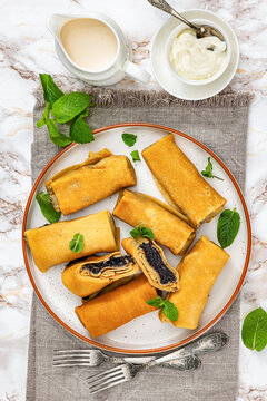 Sweet thin crepe rolls stuffed with poppy seed
