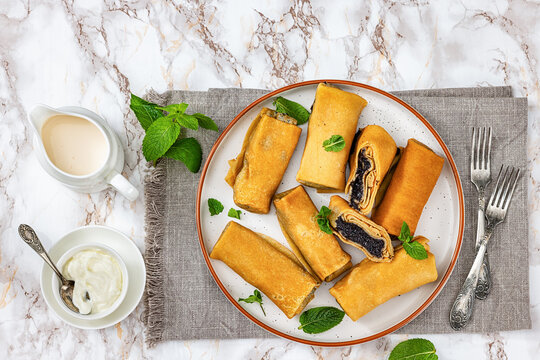 sweet thin rolled crepes with poppy seed