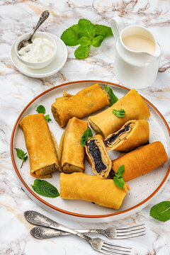 Nalysnyky thin crepes filled with poppy seed paste