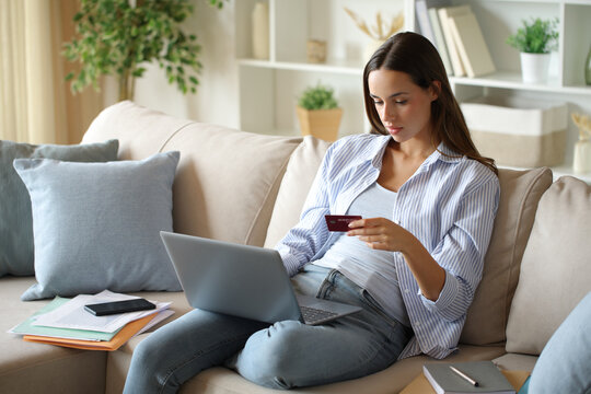 Telecommuter working and paying online working at home