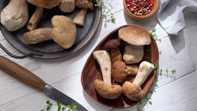 Fresh porcini mushrooms still life on table