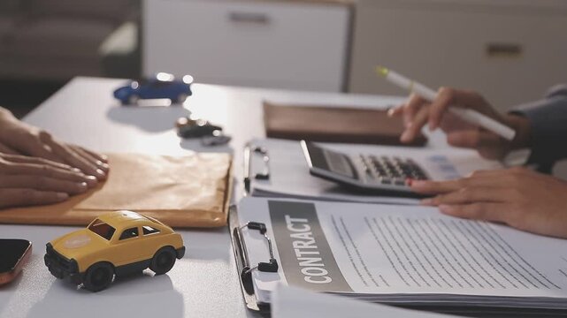 Car sale or rental concept, Closeup Dealership manager signing car insurance document or lease paper contract. Customer with car dealer agent making deal, sign on agreement document contract in office