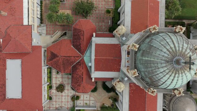 Aerial view of Memorial Presbyterian Church with its distinctive green dome and red tiled roofs in St. Augustine, Florida, United States.