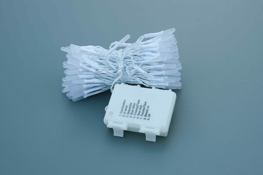 Decorative string lights with control box ready for installation in a home setting