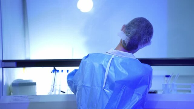 A researcher conducts clinical tests in a laboratory setting, analyzing samples and focusing on scientific experiments to discover medical breakthroughs with dedication and precision.