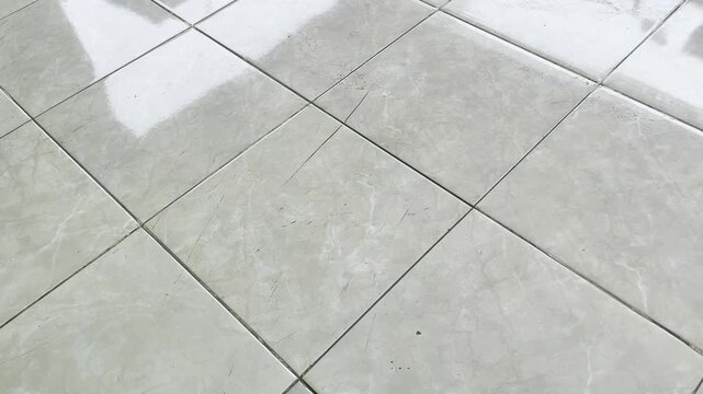 Wet glossy outdoor ceramic tile texture background with marble stone pattern