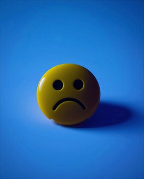 Yellow Sad Face Button on Blue Background.