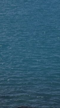 scene of blue ocean background in summer season with wave and ripple for vertical landscape concept