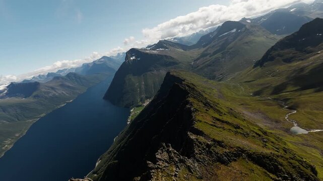 FPV flight over ridge above Hj&oslash;rundfjorden and alpine lake