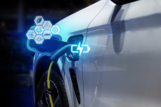 Power cable pump plug in charging power to electric vehicle EV car.