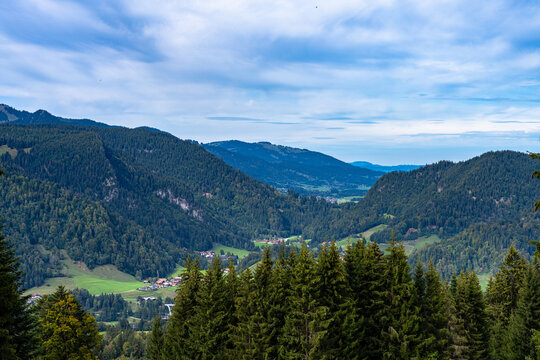 Beautiful panorama view of Allgaeu Alps and Oberstdorf town in the valley from Sollereck on hiking path on summer day, Oberstdorf, Bavaria, Germany