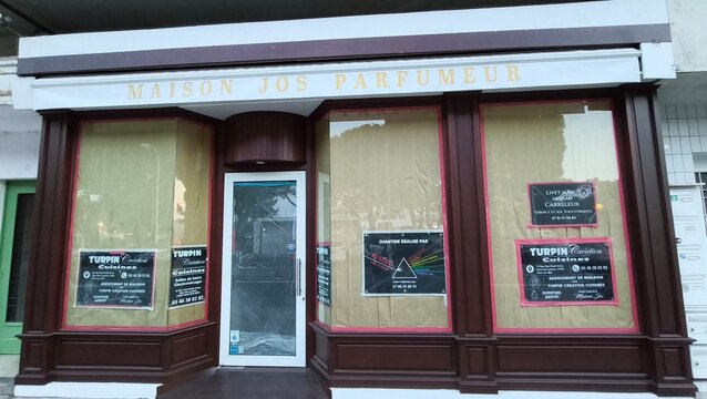 Royan, France - July 15, 2026: Charente-Maritime. Nouvelle-Aquitaine. Maison Jos Parfumeur storefront with large windows and signage, featuring decorative elements and a modern entrance