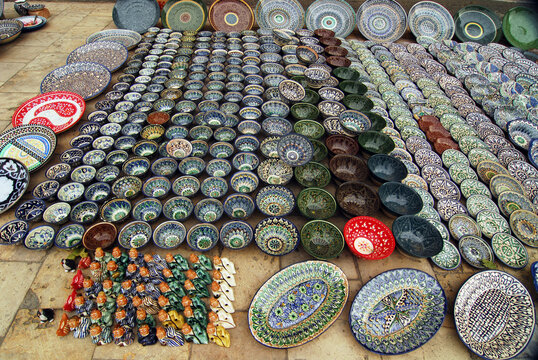 Elevated view of arranged plates and bowl in row, Bukhara, Uzbekistan