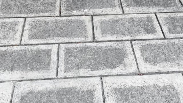 Top view of grey rectangular paving blocks texture background