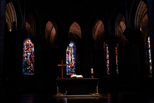 Bible illuminated by a ray of light in a cathedral